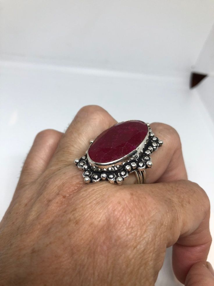 Unusual deep toned raw Ruby low content silver setting handmade size 7.5 Can be resized. My jeweler charges a $10- $20 fee All rings are shipped in a nice gift box. Check out our over a THOUSAND great reviews Engraving is $4 per letter and is not always perfect depending on the piece. It can take a few days if the jeweler is busy. This is payable to Paypal Judithsltd@gmail.com Unique Handmade Oval Ruby Ring, Unique Silver Ruby Ring With Stone Setting, Silver Ruby Ring With Large Stone For Anniversary, Unique Gift Ruby Ring With Stone Setting, Unique Ruby Ring Gift, Handmade Adjustable Ruby Ring For Anniversary, Artisan Ring With Large Stone For Gift, Handmade Oval Ruby Ring Gift, Handmade Ruby Rings As A Gift