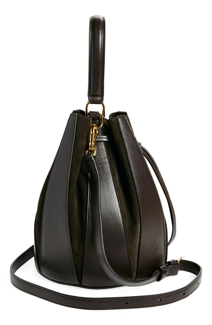 Tapered suede and leather panels structure a Spanish-crafted bucket bag designed with a drawstring-cinched closure and dual carrying options. Drawstring closure Top carry handle; removable, adjustable crossbody strap Structured silhouette with flat base for stability Unlined Leather Made in Spain Designer Handbags Modern Suede Shoulder Bag With Handle Drop, Elegant Suede Shoulder Bag With Leather Trim, Luxury Bucket Bag With Leather Trim And Double Handle, Evening Suede Bags With Leather Handles, Chic Bucket Bag With Leather Trim, Luxury Bucket Bag With Leather Trim, Leather Bucket Shoulder Bag With Leather Trim, Leather Bucket Bag With Leather Trim, Leather Bucket Bag With Shoulder Strap