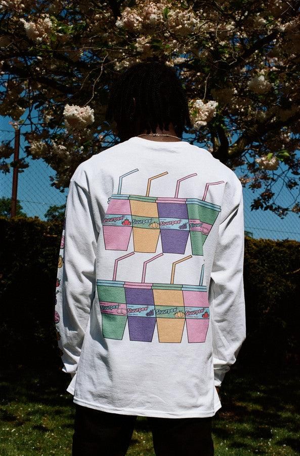 Stay cool this summer and drink Sluurpee. Grape, watermelon, peach, or strawberry. What's your flavour? Our heavyweight long sleeved t-shirts are a great all year round staple keeping you warm in the colder months, but cool enough in the warmer months. 'Sluurpee' graphic printed on the front, back and sleeves Woven label details at bottom of t-shirt and inside the collar Relaxed fit, Unisex t-shirt Both models are wearing a size large. Free stickers included in every order We have a 30 day no hassle return policy FREE delivery on all UK orders over £75 and international orders over £100 We accept Paypal and all major credit card companies Washing instructions: 30 wash with similar colours, Reshape while damp, Do not iron print, Tumble dry medium, Do not bleach Woven Label, Free Stickers, Stay Cool, White Long Sleeve, Washing Instructions, Old Town, Positive Vibes, This Summer, Return Policy