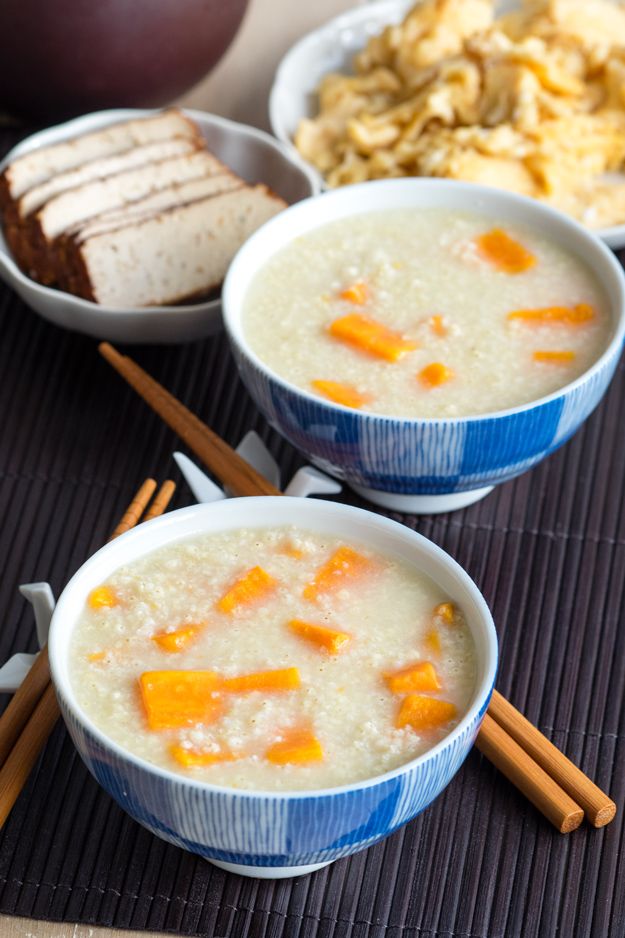 two bowls filled with rice and carrots next to other foods