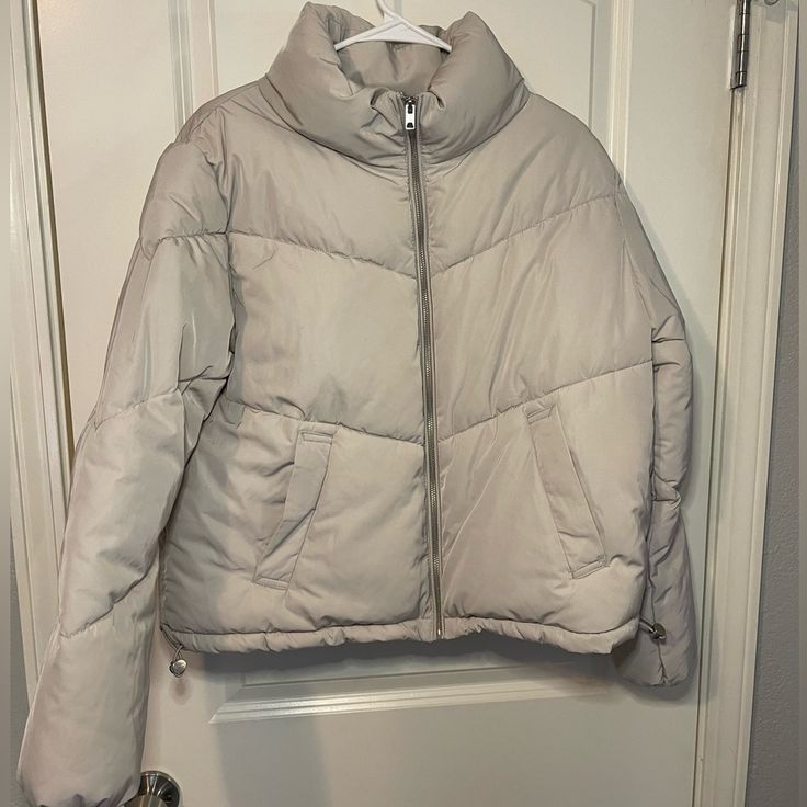 Brand New, Never Worn Cropped Puffer Jacket. No Flaws Or Issues. Very Warm And Comfortable. Color Is A Light Beige With Silver Zipper And Details To Cinch The Waist. Two Roomy Front Pockets. High Collar And Cinched Wrists To Keep You Warm. Love This Jacket, But Not My Style Anymore. Trendy Beige Puffer Jacket For Spring, Trendy Taupe Winter Outerwear, Trendy Taupe Outerwear For Winter, Casual Cream Outerwear From H&m, Casual Cream Outerwear By H&m, Trendy H&m Winter Outerwear, H&m Cream Outerwear For Spring, H&m Cream Spring Outerwear, Cream H&m Outerwear For Spring