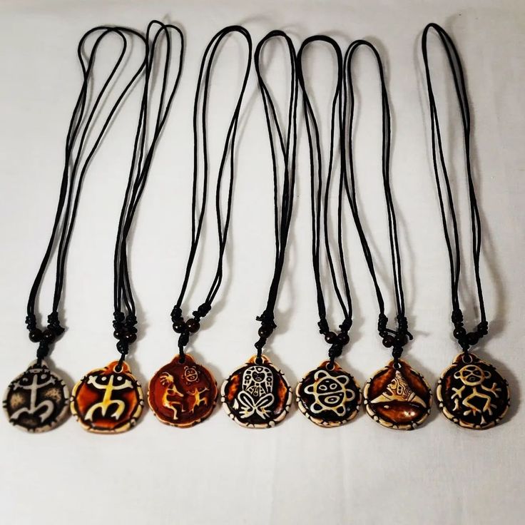 Double-sided Taino Symbols Adjustable Necklaces Festival Pendant Necklace With Adjustable Cord, Assorted Adjustable Spiritual Jewelry, Brown Pendant Jewelry For The Beach, Brown Pendant Jewelry For Beach, Symbolic Brown Pendant Necklace, Vintage Necklace With Adjustable Cord For Festivals, Adjustable Medallion Amulet Necklaces, Adjustable Medallion Necklace In Amulet Style, Handmade Adjustable Amulet Charm Necklaces