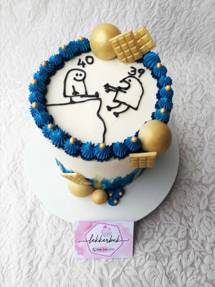 a cake decorated with blue and gold decorations