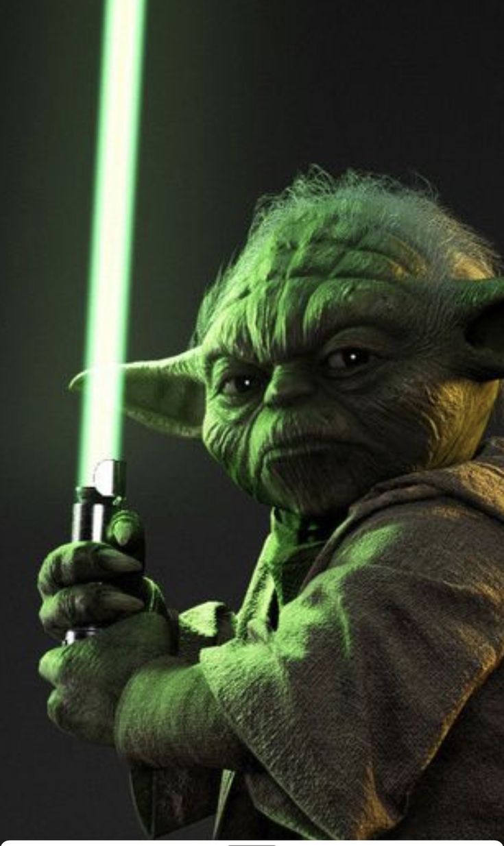 yoda holding a light saber in his right hand and pointing it at the camera