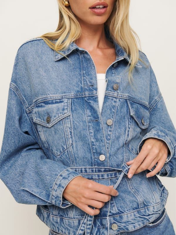 Denim time. Shop the Luna Belted Denim Jacket from Reformation, a relaxed-fit denim jacket with a collared neckline and belt at the waist. Belted Denim Blue Outerwear For Fall, Casual Denim Jacket With Belt Loops, Belted Denim Jacket For Workwear, Long Sleeve Denim Outerwear With Belt Loops, Fall Denim Jacket With Belted Cuffs, Utility Style Belted Denim Outerwear, Utility Style Denim Belted Outerwear, Utility Style Denim Outerwear With Belt, Utility Denim Outerwear With Belt