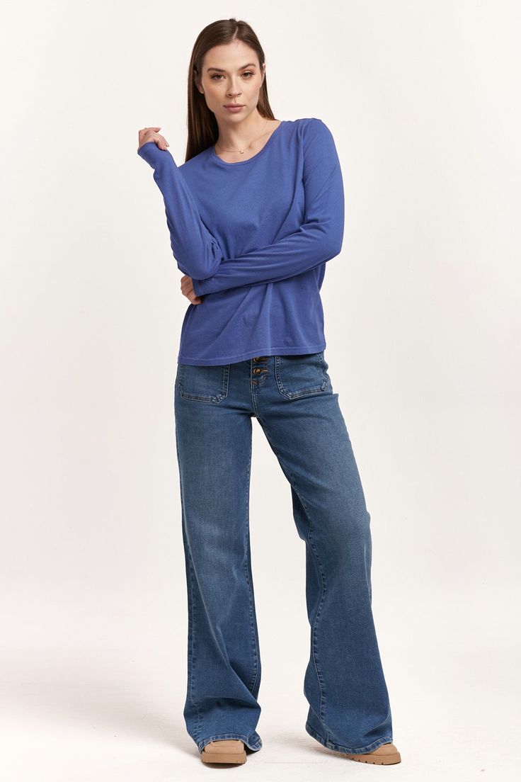 image of a female model wearing a KATHY LONG SLEEVE JERSEY TEE BLUE LOLITE DEAR JOHN DENIM Blue T-shirt For Everyday Fall Wear, Relaxed Fit Light Indigo Top For Everyday, Washed Blue Everyday Top For Fall, Everyday Washed Blue Top For Fall, Washed Blue Top For Everyday Fall Wear, Everyday Soft-washed Washed Blue Tops, Everyday Light Indigo Cotton Tops, Blue Everyday T-shirt For Fall, Relaxed Fit Washed Blue Tops