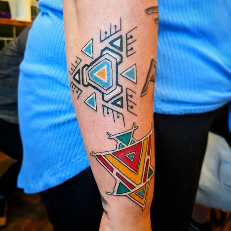 a person with a colorful tattoo on their arm