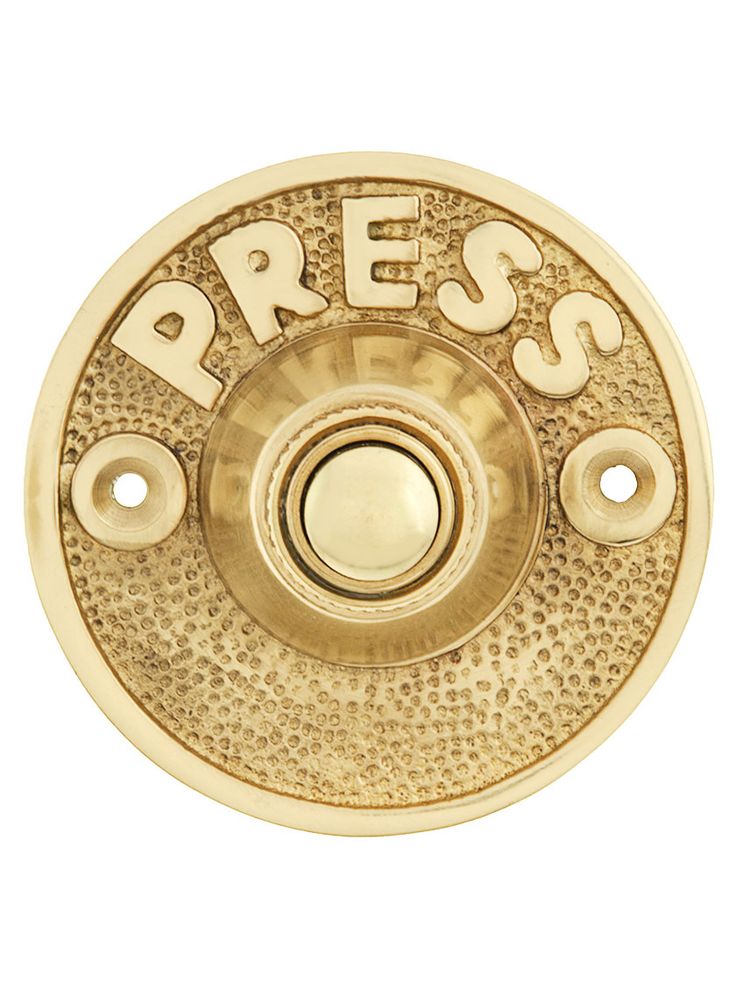 brass plated press button with the word press on it's center and bottom