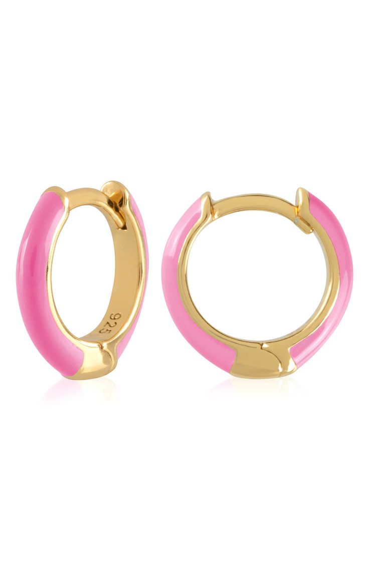 Easy-to-wear hoop earrings will add significant polish to even your most casual ensembles. 1/2" drop; 1/8" width Hinge with snap-post closure Sterling silver with goldtone plate/enamel Imported Trendy Pink Enamel Jewelry, Trendy Pink Enamel Earrings, Trendy Hypoallergenic Enamel Earrings, Enamel Huggie Jewelry Gift, Trendy Gold Enamel Hoop Earrings, Trendy Enamel Earrings For Everyday, Everyday Round Enamel Earrings, Hoop Huggie Earrings In Enamel, Hinged Hoop Huggie Earrings