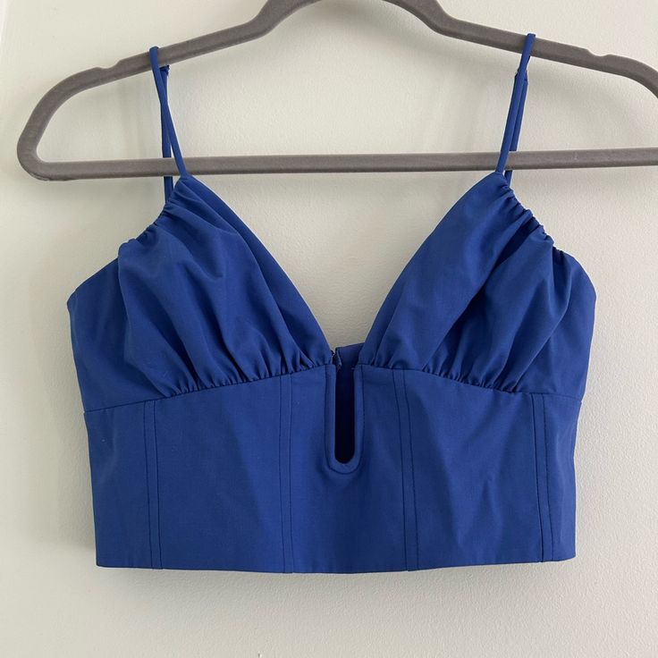 Royal Blue, Adjustable Straps, No Padding. Never Worn Chic Blue Camisole With Built-in Bra, Blue Crop Top With Built-in Bra And Spaghetti Straps, Blue Camisole Crop Top With Straps, Blue Cropped Tank Top For Party, Blue Cami Crop Top With Adjustable Straps, Spring Blue Bra-friendly Tank Top, Spring Blue Camisole With Built-in Bra, Blue Crop Top With Spaghetti Straps And Built-in Bra, Blue Bra-friendly Tank Top For Spring