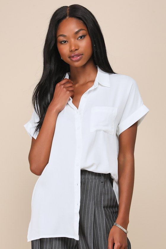 Keep it cute and classic in the Lulus Blythe White Short Sleeve Button-Up Top! Soft, lightweight woven fabric creates a collared neckline and cuffed, short sleeves. Relaxed bodice features a full button placket and front patch pocket. Notched, rounded hem. Pair with denim and a blazer for a casual-chic workday look! Fit: This garment fits true to size. Length: Above mid-thigh. Size medium measures 27.75" from shoulder to hem. Bust: Great for any cup size. Waist: Not Fitted - comfortable room thr Summer Collared Blouse For Work, Spring Short Sleeve Button-up Shirt, Collared Blouse For Summer Workwear, Classic Spring Button-up Short Sleeve Shirt, Classic Summer Shirt With Back Button Closure, Summer Blouse With Spread Collar And Button Closure, Summer Workwear Blouse With Shirttail Hem, Classic Short Sleeve Button-up Shirt For Spring, Fitted Solid Shirt For Day Out