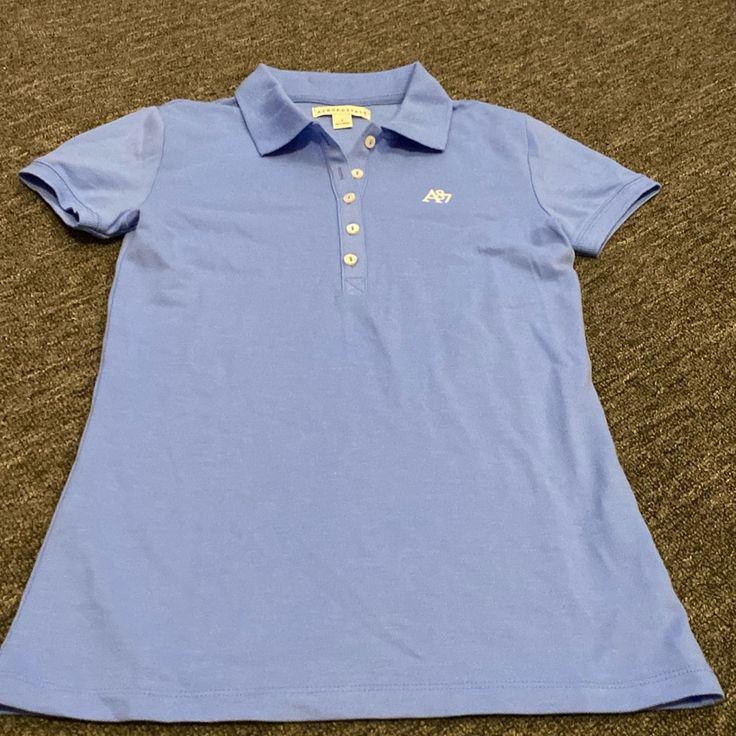 Lovely Blue Short Sleeve Shirt. - Excellent Condition - Never Worn Blue Short Sleeve Polo Shirt For School, Blue Casual Polo Shirt For School, Blue Casual School Polo Shirt, Casual Blue Polo Shirt For School, Basic Blue School Tops, Basic Blue Tops For School, Casual Blue Shirt For School, Preppy Blue Cotton Polo Shirt, Light Blue Casual Polo Shirt