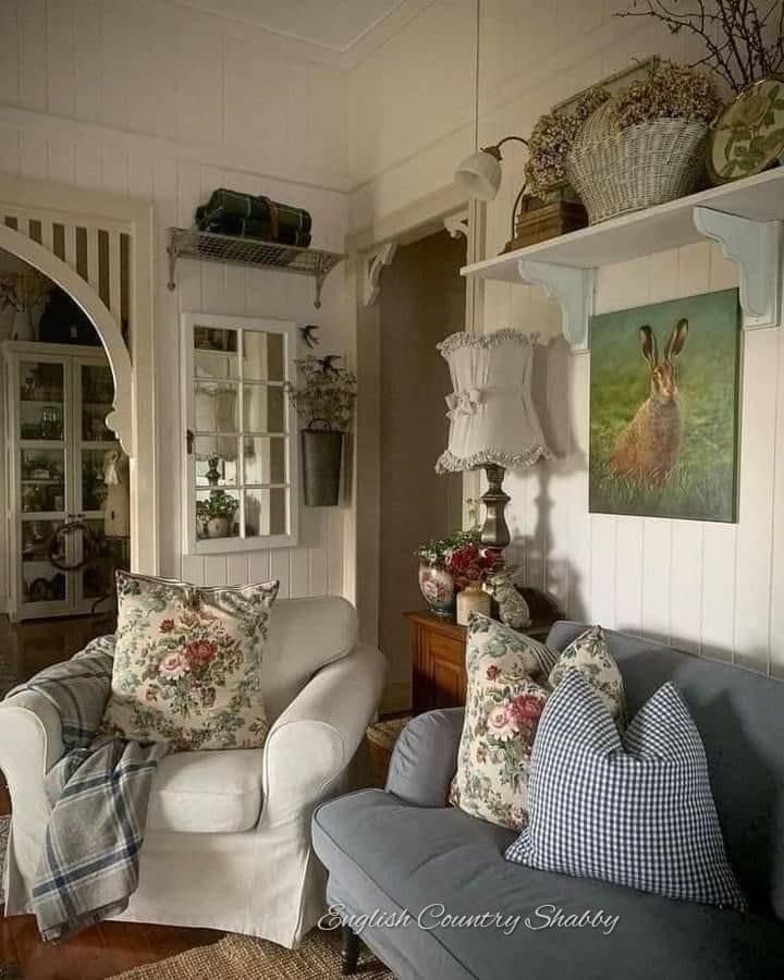 a living room filled with furniture and pillows