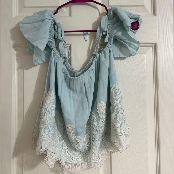 Show Me Your Mumu Women’s Piper Blue Lace Top Blouse Shirt Off Shoulder Sz Sm. Gorgeous Shirt! Even Though Original Tag Is Pinned To The Shirt, The Inside Label Tags Are Missing So I Can’t Call It Nwt. But Looks To Be In Like-New Condition! Guessing Size Small Beaded On Measurements Of 14 In Armpit To Armpit And 14 Inches Top To Bottom. Fitted Blue Lace Top For Summer, Light Blue Blouse For Vacation In Spring, Light Blue Blouse For Spring Vacation, Blue Cotton Blouse With Lace Trim, Fitted Blue Lace Top Blouse, Blue Short Sleeve Blouse With Lace Trim, Blue Tops With Lace Trim For Vacation, Summer Light Blue Tops With Lace Trim, Light Blue Short Sleeve Blouse For Vacation