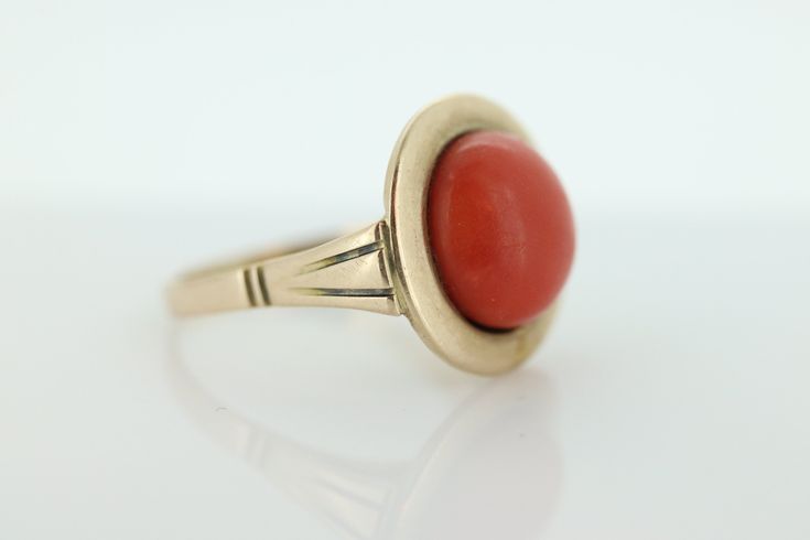 Amazing Statement ring. 8k yellow gold set with a Deep Orange CORAL cabochon gem. The Coral is round cabochon Condition: Shows little signs of wear. Details: 11mm orange Coral 16mm Round top table 8mm rise off finger 5.0grams total weight Marked 333 (8K) Size 8 Formal Yellow Gold Cabochons With Bezel Setting, Fine Jewelry Domed Gemstone Cabochons, Gold Domed Gemstone Cabochons, Domed Gold Gemstone Cabochons, Domed Gemstone Cabochons Fine Jewelry, Yellow Gold Gemstone Cabochons In Classic Style, Classic Yellow Gold Gemstone Cabochons, Vintage Round Gemstone Cabochons, 14k Gold Dome Ring With Cabochon