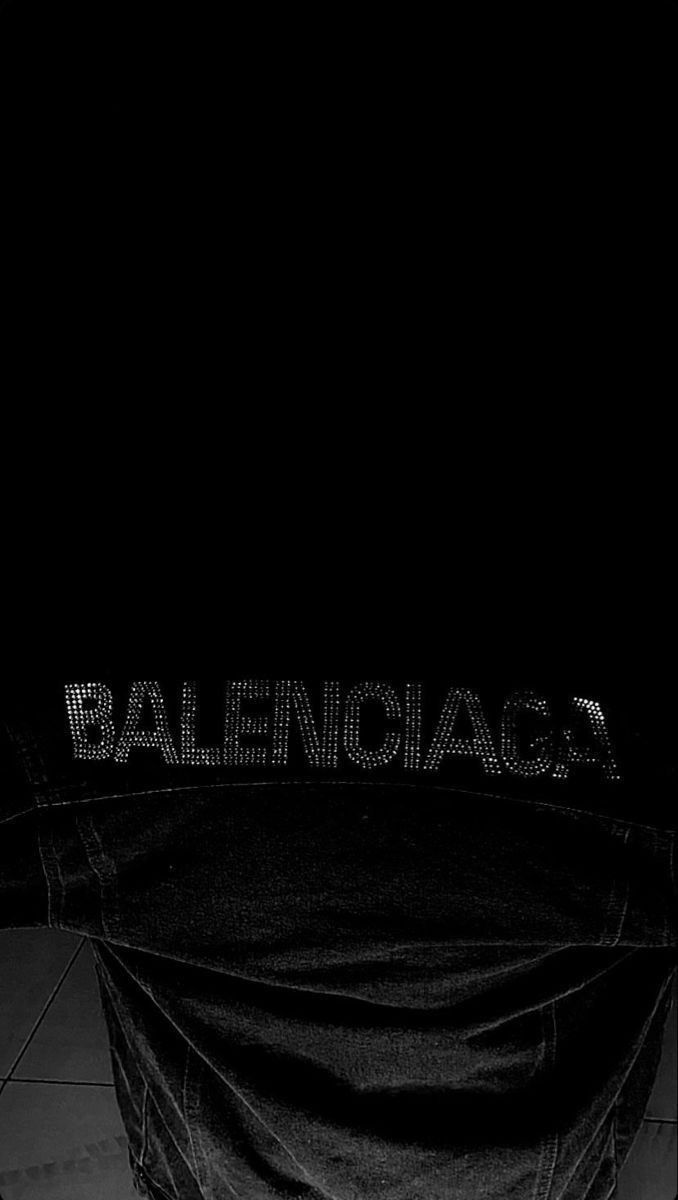 a black and white photo of a person on a skateboard with the word balenoga written on it