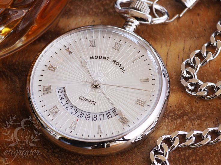 "This stunning Mount Royal pocket watch features a quartz calendar movement and classic white Roman dial. The open face is surrounded by a chrome plated case complete with a polished back, ready to be engraved with your custom personalization. This pocket watch comes with a matching Albert chain, presentation box and two year guarantee. Movement: Quartz Calendar Dial: White Roman Case: Chrome Plated - Polished Back Complimented: With matching Belt Loop chain Gift Packaging: Presentation box. Two Elegant Stainless Steel Watch Accessories With Date Display, Elegant White Pocket Watch With Chronometer, Elegant White Pocket Watch For Formal Events, Elegant White Pocket Watch For Formal Occasions, Silver Watches With Subdials For Wedding, White Gold Watches With Date Display For Gift, White Gold Watches With Date Display As Gift, Silver Wedding Watches With Subdials, Round Watches With Date Display As Gift