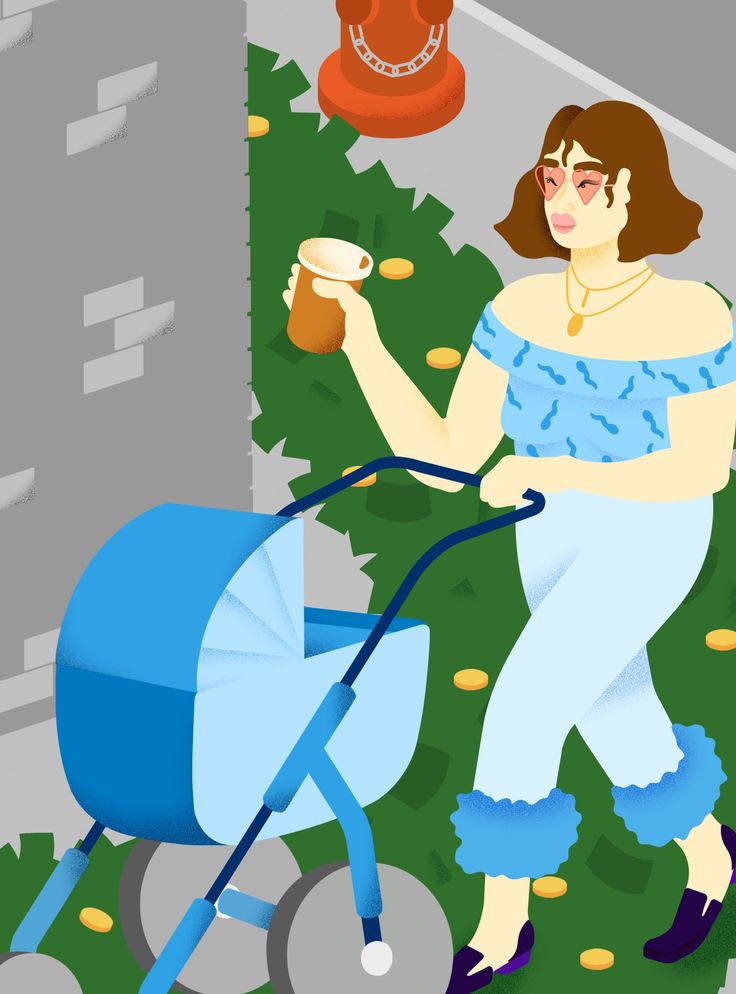 a woman walking down the street with a baby carriage