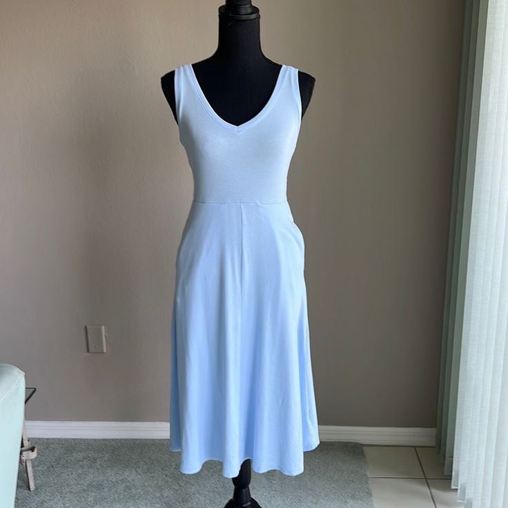 27.5” Waist To Hem 41.5” Top Of Non Adjustable Straps, V-Neck Front And Back Neckline Stretchy Ribbed Fabric Size: X-Small Color: Light Blue Side Hidden Pockets On Side Seams Pull-On Design 57% Cotton,38% Modal, 5% Spandex Stretch V-neck Midi Dress For Daywear, Blue V-neck Dress For Summer Daywear, V-neck Midi Dress With Pockets For Daywear, Light Blue V-neck Dress With Pockets, Stretch Midi Dress V-neck For Daywear, Casual Fitted V-neck Dress For Daywear, Blue V-neck Dress With Pockets, V-neck Midi Dress For Loungewear, Fitted V-neck Midi Dress For Loungewear