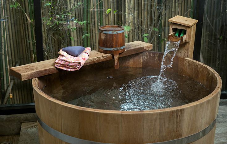 a wooden barrel with water running out of it