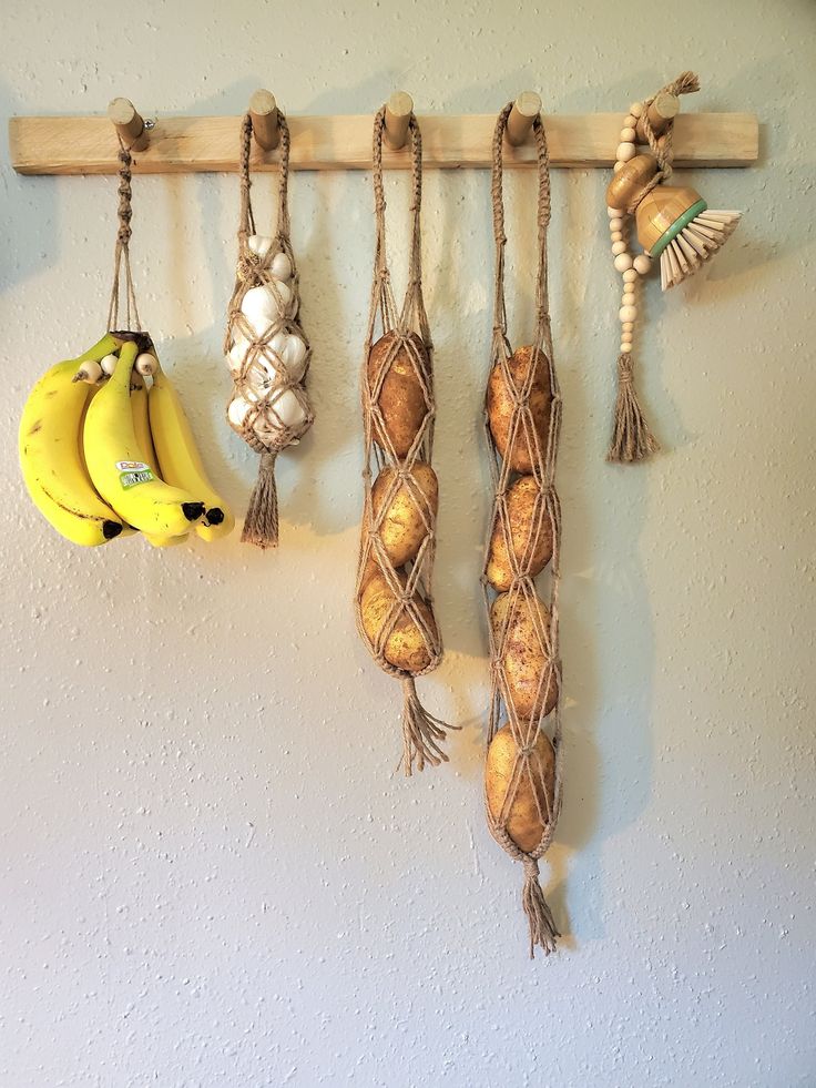 bananas, garlic and other items hanging on a wall