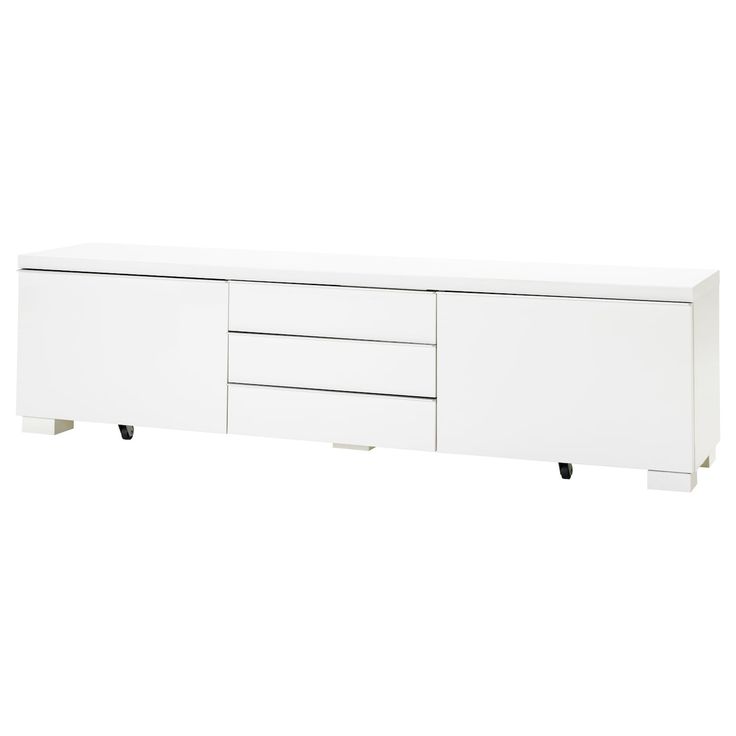 a white cabinet with three drawers and two doors on the bottom, in front of a white background