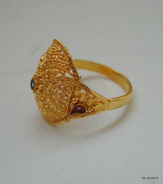 TRADITIONAL DESIGN 20k GOLD RING FROM RAJASTHAN INDIA, GREAT HANDMADE DESIGN, MADE OF SOLID 20 CARAT YELLOW GOLD, GOOD FOR JEWELLERY COLLECTION. Usa ring size - 7 (we can adjust the size)Width of top - 1.7 cm(0.67")weight - 4 gramsMaterial - 20k solid yellow gold. 22k Gold Ring For Festive Occasion, 22k Gold Ring Jewelry For Festive Occasions, Festive 22k Gold Ring, Yellow Gold Filigree Jewelry For Marriage, 22k Gold Temple Jewelry Wedding Ring, 22k Gold Filigree Wedding Ring, 22k Gold Filigree Ring For Wedding, Gold Temple Jewelry Ring, Gold Meenakari Rings For Festive Occasions