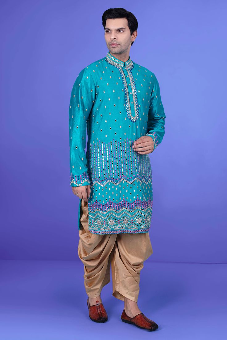 Enhance your style with our Mens Kurta salwar J171-N217. This premium piece features intricate mirror and thread work, elevating the look to a whole new level. Perfect for special occasions or elevating your everyday style. Experience luxury and elegance in every wear. Blue Bollywood Bandhgala With Mirror Work, Designer Blue Sherwani With Gota Work, Blue Sherwani With Gota Work, Blue Bollywood Sherwani With Gota Work, Blue Sherwani With Gota Work For Festivals, Festive Blue Sherwani With Gota Work, Blue Sherwani With Gota Work For Eid, Turquoise Kurta With Dabka Work For Eid, Turquoise Kurta With Resham Embroidery For Eid