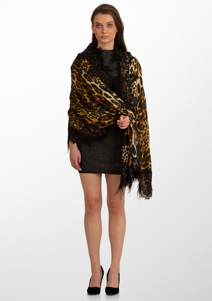 Embrace the wild side of fashion with this black Leopard print scarf woven from the wool and silk. This fierce print is stylishly tamed by a hand crafted bold tonal black Chantilly lace and black ostrich feathers border. This statement piece seamlessly combines the timeless allure of a leopard print with unmatched style, making it the perfect accessory to turn heads on any occasion. Whether draped casually or enhancing a chic evening ensemble, this scarf combines glamour, warmth and sophisticati Black Silk Scarf For Party, Luxury Black Scarf For Fall, Luxury Black Silk Scarves, Luxury Black Winter Scarves, Luxury Black Silk Scarf For Evening, Chic Black Scarves For Fall, Black Silk Scarf For Fall, Chic Black Silk Scarf For Fall, Chic Black Scarves For Evening