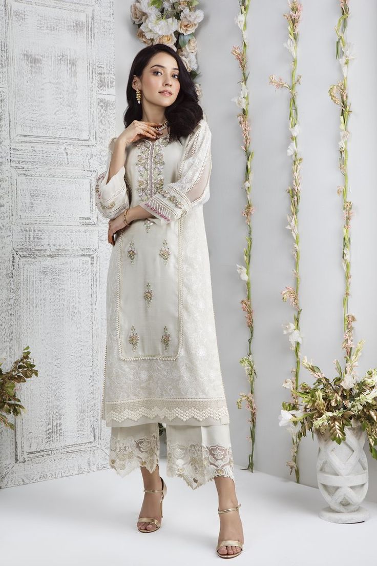 Porcelain | Pakistani Designer Outfit | Sarosh Salman Cream Sets With Pearl Embroidery For Eid, Elegant Cambric Sharara With Traditional Drape, Cambric Salwar Kameez For Wedding, Semi-stitched Traditional Wear With Lace Work For Eid, Off-white Pearl Embroidered Set For Eid, Off White Sets With Pearl Embroidery For Eid, Elegant Pearl Embroidered Fabric For Eid, Traditional Off White Sharara With Pearl Embroidery, Semi-stitched Pearl Embroidered Lawn Suit For Eid