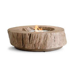 an outdoor fire pit made out of wood with flames burning in the center, on a white background