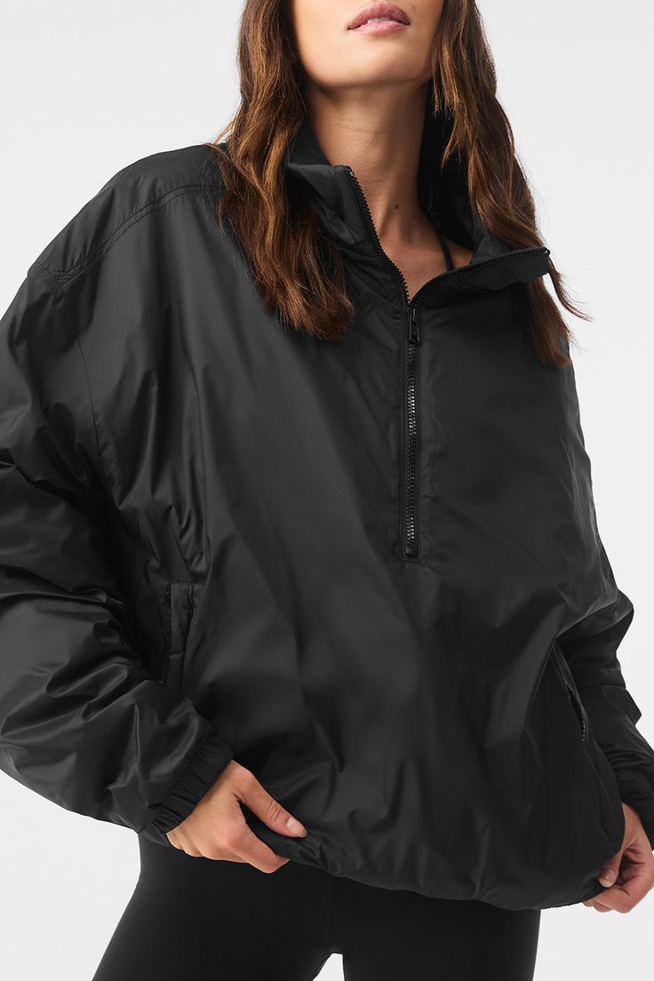 Running to your workout in the rain? Reach for the Latitude Pullover. It’s lightly filled (for a touch of warmth) with functional details like a half-zip collar, zippered side pockets, banded cuffs and a banded hem. Fitwise, it’s generous and oversized. And it’s made from 100 percent nylon—the kind that’s durable, swishy and ready to face the elements. Black Half-zip Windbreaker For Outdoor Activities, Black Half-zip Track Jacket For Outdoor, Black Half-zip Techwear Windbreaker, Black Nylon Half-zip Windbreaker, Black Functional Half-zip Outerwear, Black Half-zip Nylon Track Jacket, Black Nylon Half-zip Track Jacket, Black Waterproof Windbreaker In Athleisure Style, Black Half-zip Techwear Outerwear