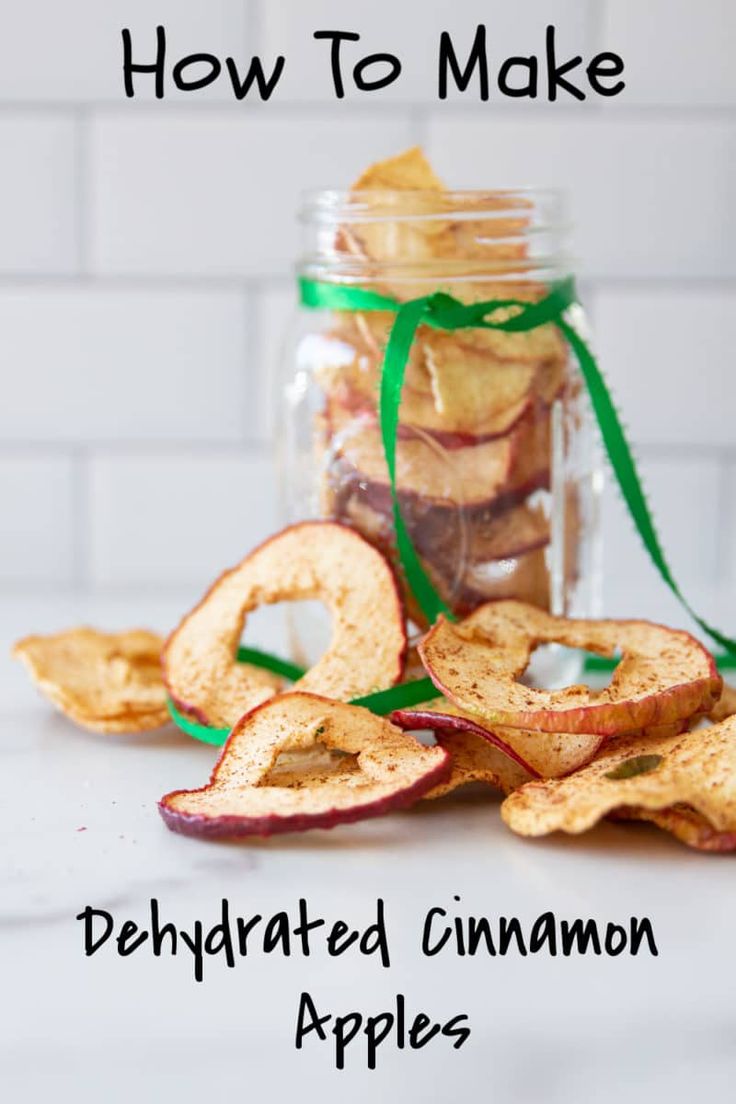 an apple chips in a jar with the title how to make dehydrated cinnamon apples