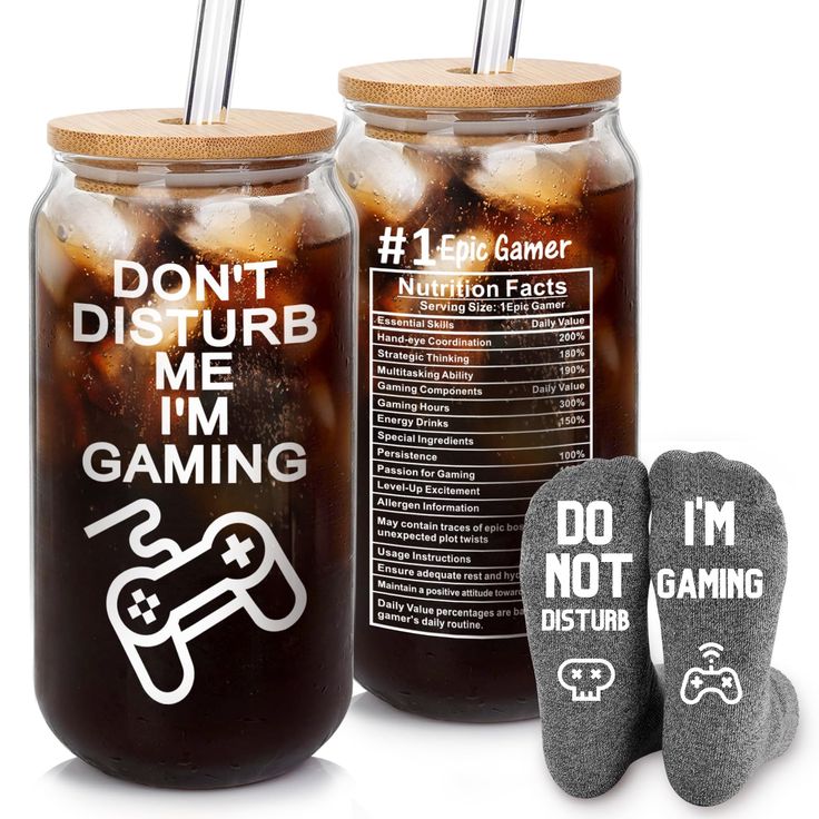 two mason jars with socks next to them and one has a label for don't disturb me i'm gaming