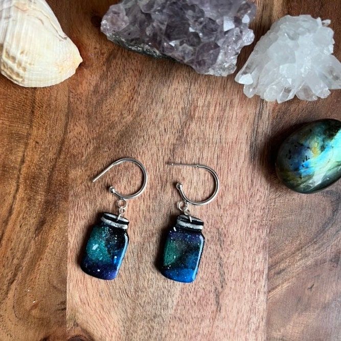 Miniature mason jar earrings in my classic galaxy pattern 🌌Ideal gift for those who love to watch the stars.  Stainless steel stud findings Jar Earrings, Watch The Stars, Space Earrings, Galaxy Pattern, Earrings Cute, Custom Earrings, Mason Jar, Polymer Clay Earrings, Clay Earrings