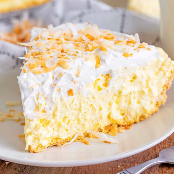 a piece of coconut cream pie on a white plate