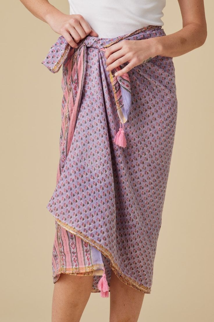 Hand-Block Printed Sarong with Tassels Design Features: Endless styling possibilities: beach cover-up, stylish scarf, or dress Intricate hand-block printed designs Playful tassel accents Material: 100% Cotton Voile Craftsmanship: Crafted with care and attention to detail Multicolor Bohemian Cotton Cover-up, Bohemian Multicolor Cotton Cover-up, Bohemian Beach Sarong With Block Print, Summer Beach Sarong With Block Print, Traditional Summer Sarong With Block Print, Summer Beachwear Sarong With Block Print, Block Print Sarong For Summer Beachwear, Traditional Block Print Sarong For Summer, Summer Vacation Sarong With Block Print