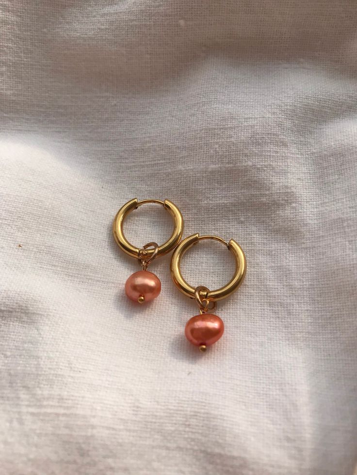 Handmade earrings Real pearl Gold coloured stainless steel hoop with clicker closure Metal Huggie Earrings As Gift, Pink Dainty Huggie Jewelry, Orange Small Hoop Jewelry As Gift, Orange Small Hoop Jewelry For Gifts, Orange Small Hoop Jewelry Gift, Orange Small Hoop Earrings For Gift, Small Hoop Earrings Orange For Gift, Small Hoop Earrings Orange Gift, Small Hoop Earrings In Orange For Gifts