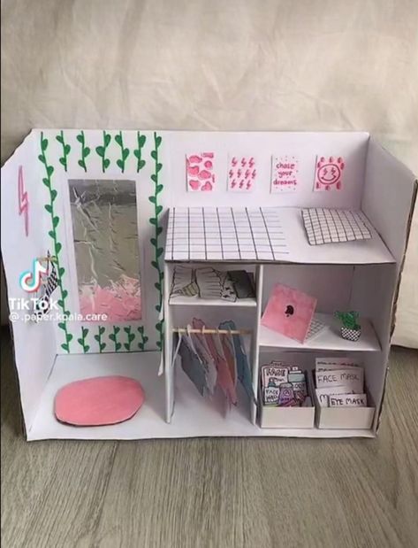 a doll house made out of paper and cardboard