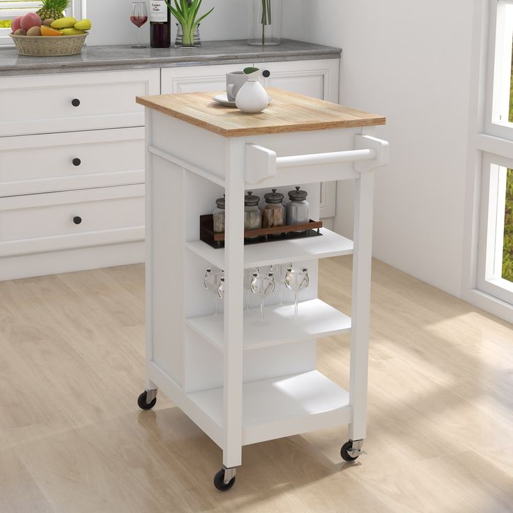 a white kitchen cart with food on it