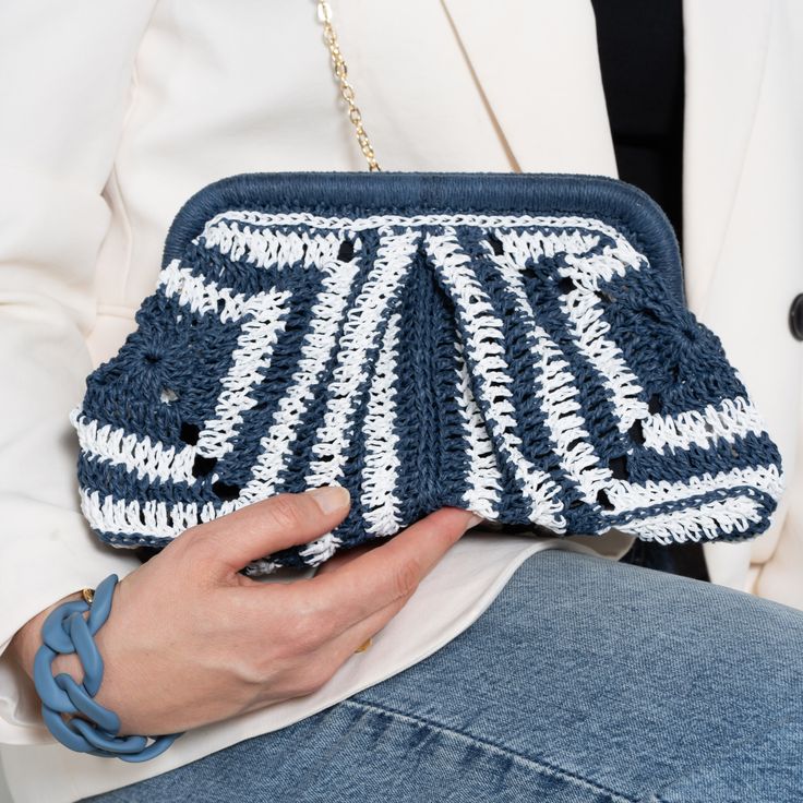 Our new Crochet Straw Clutch Bag is a unique piece, carefully handcrafted by skilled women artisans in traditional Granny Square motifs. It is an ideal choice for bohemian summer days, nights and especially summer weddings It can be used as a crossbody bag with a long strap or an elegant clutch without a strap. ✔ The main material is 100% natural straw paper yarn. It is lightweight and eco-friendly. ✔ It has a liner for easy use and an inner pocket. ✔ It comes with a removable black metal chain. Handmade Handheld Pouch, Artisan Rectangular Crochet Bag, Elegant Handheld Clutch In Natural Color, Elegant Handmade Natural Clutch, Elegant Handheld Natural Clutch, Elegant Natural Handheld Clutch, Elegant Natural Color Handheld Clutch, Handmade White Pouch Clutch, Handmade White Clutch For Daily Use