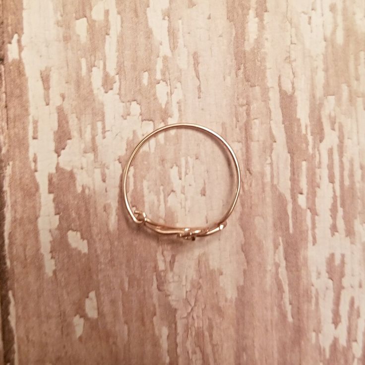 This little ring is so simple and beautiful and perfect for stacking. It's made with 14k yellow gold filled and features a treble clef as the focal. The band has been hammered for texture and strength and measures approximately 1mm wide. The third pic shows how the ring will be boxed for shipping. What is Gold-Filled? Gold-filled is an economical alternative to solid gold. By law, it has 1/20th by weight layer of 14 karat gold permanently bonded over a core of base metal. It is tarnish-resistant Adjustable 14k Gold Midi Rings For Everyday, Adjustable 14k Gold Initial Ring, Adjustable 14k Gold Initial Ring For Everyday, Adjustable 14k Gold Stackable Toe Rings, Adjustable Yellow Gold Stackable Rings With Simple Design, Dainty Adjustable Stackable Rings, Classic Adjustable Stackable 14k Gold-filled Rings, Classic Adjustable Stackable 14k Gold Filled Rings, Adjustable Gold Initial Ring In 14k