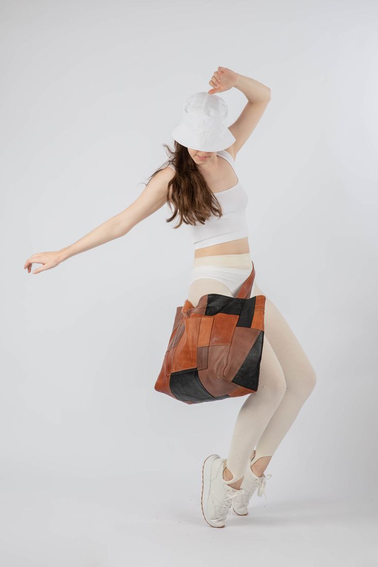 This up-cycled tote is an ode to sustainability and stand against waste. The patchwork design is entirely handmade of the remaining pieces of leather from our other items that would otherwise be disposed of. Additionally, it is a true piece of art, with each patch meticulously positioned and stitched together to create a harmonious and elegant pattern. It is incredibly durable, as any sustainable product should be, and biodegradable as the leather is 100% vegetable tanned. Made of the softest la Patchwork Hobo Tote Bag, Everyday Brown Patchwork Shoulder Bag, Brown Patchwork Hobo Bag For Daily Use, Brown Rectangular Hobo Bag With Patchwork, Brown Patchwork Hobo Bag, Leather Patchwork Tote Shoulder Bag, Everyday Patchwork Hobo Tote Bag, Upcycled Leather Bag For Daily Use, Daily Use Upcycled Leather Shoulder Bag