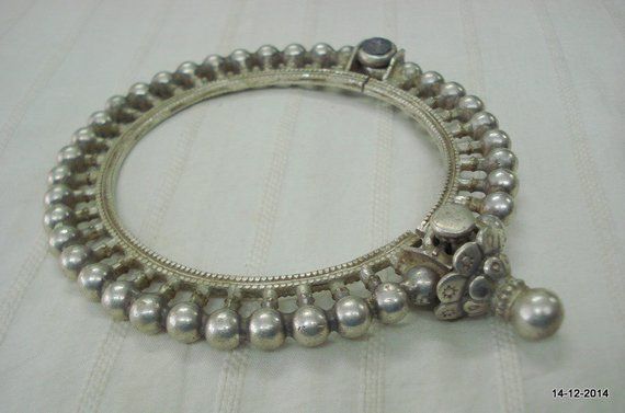 VINTAGE ANTIQUE GREAT DESIGN TRIBAL OLD SILVER HINGE BRACELET BANGLE OR ARMLET (KAKAN) FROM RAJASTHAN INDIA. Silver guard bangles (Khatria or bangri gokru) with solid balls perimeters. Worn by DANGEE and PATEL tribal people of Rajasthan. One quarter-hinged part can be opened by central pin. Piece is good worn with a great antique look. See similar samples in” Traditional jewelry of India” by Oppi Untractht.Inner diameter - 8.1 cm(3.2") Inner circumference - 25.4 cm(10")Outer diameter - 12 cm(4.7 Bohemian Oxidized Wedding Bangle, Bohemian Silver Bangle With Tilla, Bohemian Tilla Bangle For Ceremonial Occasions, Heavy Bohemian Bangle In Antique Silver, Bohemian Tilla Bangle For Festivals, Antique Silver Bangle For Festive Occasions, Heavy Bohemian Bangle For Rituals, Silver Round Bohemian Bangle, Silver Traditional Bangle For Festival