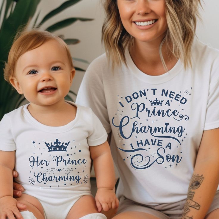 Mom and Son T-shirts ♥ Mix and match Mommy and Me T-shirts and Bodysuit to create your own custom set -  Cute coordinated tees for a mother and her son: Prince Charming Shirt, Youth and Toddler Sons Tee, Bodysuit Her Prince Charming. Crafted with love, our matching t-shirts and bodysuits feature the adorable phrase 'I don't need a Prince Charming, I have a son' on the Mom's t-shirt, and 'Her Prince Charming' on the youth, and toddler tees, and on the baby bodysuit --perfect for celebrating the unique connection between mother and child and for adding a touch of cuteness between a mother and her son. Do not hesitate to contact me if you would like to customize the t-shirts. Attention : each t-shirt is sold separately. You need to choose the size separately for the Mom, the Youth, the Toddle Mom And Son Matching Shoes, Mother's Day Crew Neck T-shirt, Funny Tops With Text For Parenting, Funny Parenting Tops With Text, Funny Parenting Top With Text, Funny Text Tops For Parenting, White Text Print T-shirt For Family, White Tops With Custom Parenting Print, White Top With Custom Parenting Print