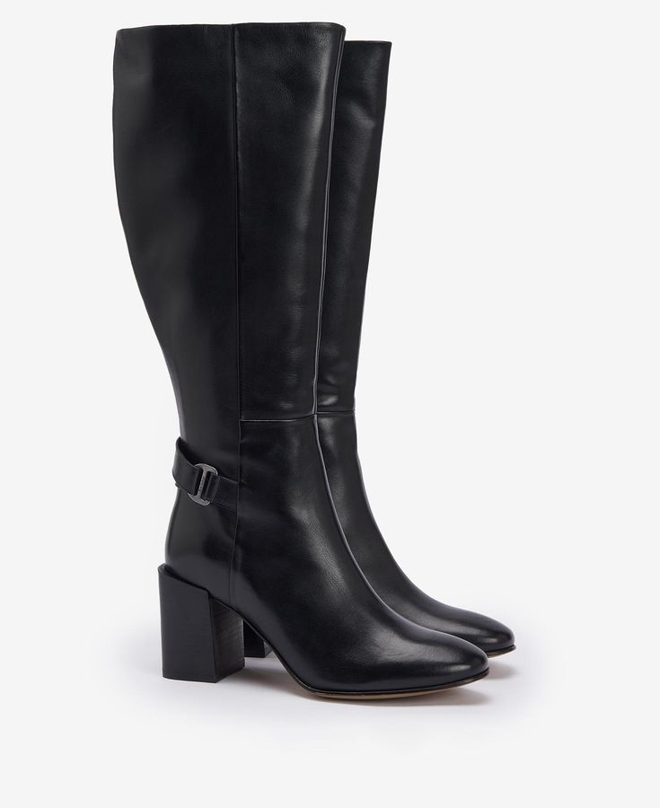 Take your outfit from day to night with the Barbour Saskia Knee-High Boots. Crafted from buttery leather, this style is sat atop a sophisticated block heel for elegance and comfort in one. Detailed with a branded buckle to the ankle and wrap-around strap, they are perfect for dressing up any outfit. Elegant Wide Calf Boots With Stacked Heel, Formal Boots With Block Heel, Formal Block Heel Boots, Elegant Square Toe Block Heels For Fall, Elegant Heeled Boots With Reinforced Block Heel, Elegant Knee-high Heeled Boots With Stacked Heel, Classic Block Heel Boots For Workwear, Elegant Boots With Reinforced Block Heel, Modern Wide Calf Heeled Boots For Formal Wear