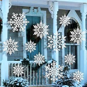 snowflakes on the side of a house with wreaths in front of it