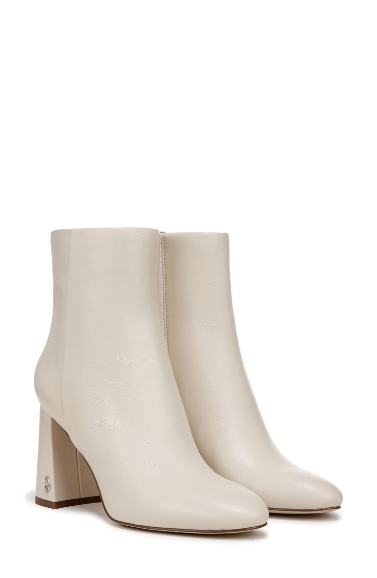 An almond toe and wrapped block heel balance a versatile bootie fashioned with a side zipper for easy entry. 3 1/4" heel 5" shaft Side zip closure Leather upper/synthetic lining/rubber sole Imported Cream High Ankle Heeled Boots With Reinforced Heel, Cream Ankle Booties With Stacked Heel, Cream Ankle Boots With Stacked Heel, Cream High Ankle Boots With Stacked Heel, Beige Boots With Stacked Block Heel, Cream Heeled Boots With Stacked Heel And Medium Width, Cream Boots With Sculpted Heel And Medium Width, Beige Heeled Boots With Sculpted Block Heel, Cream Boots With Sculpted Heel Medium Width