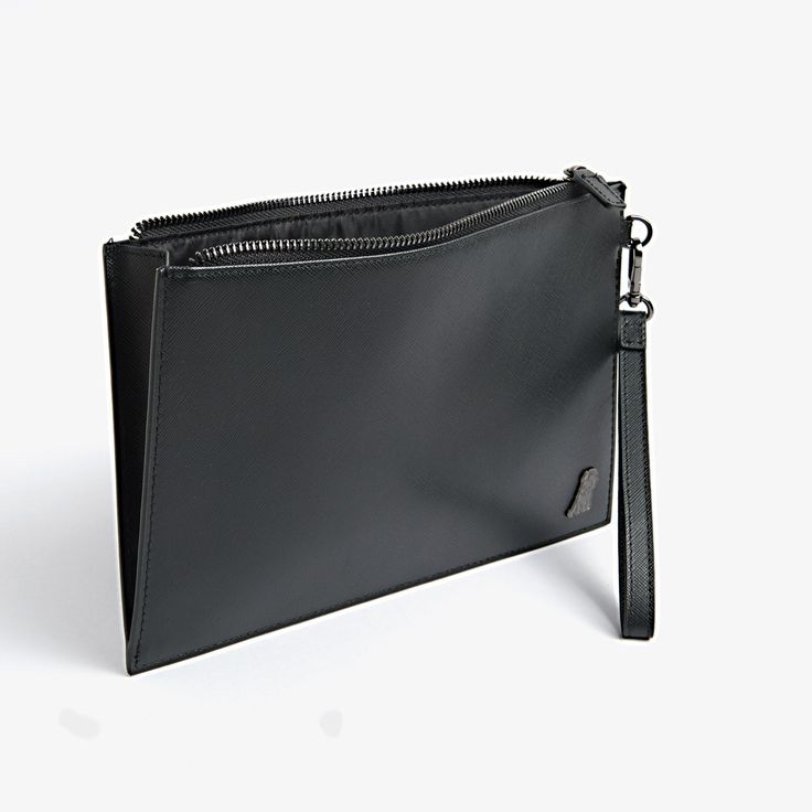 Carry all your most important items in style with this luxurious, leather clutch with embellished with a silver plaque. 100% Leather Luxury Wallets With Zipper Pouch For Evening, Luxury Evening Wallets With Zipper Pouch, Luxury Evening Wallet With Zipper Pouch, Luxury Leather Wallets With Silver-tone Hardware, Luxury Leather Wallet With Silver-tone Hardware, Classic Rectangular Clutch With Silver-tone Hardware, Chic Rectangular Clutch With Palladium Hardware, Classic Rectangular Clutch With Palladium Hardware, Elegant Black Pouch Wallet