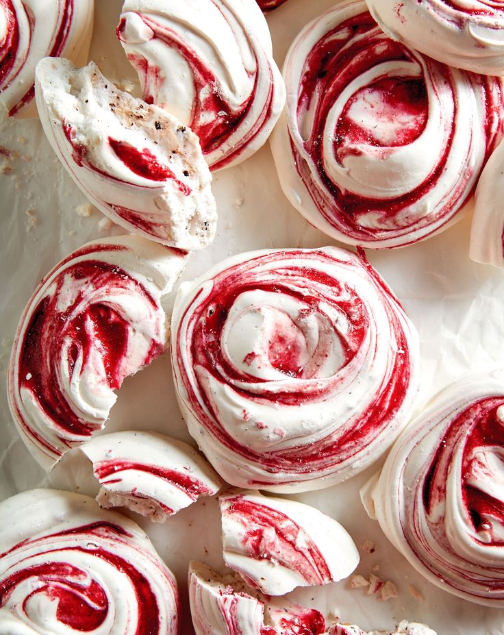 red and white swirled doughnuts sitting on top of each other